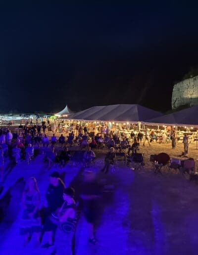 The evening crowd with a video projection on the Old Stone Quarry wall